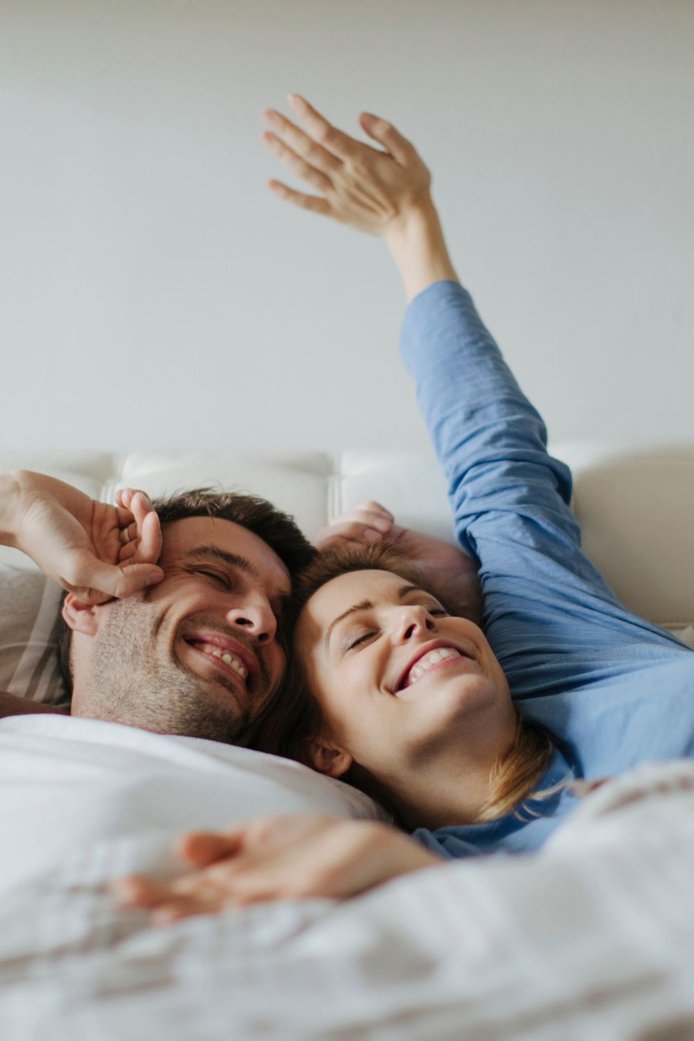 A couple waking up together